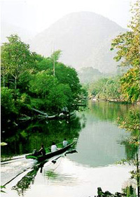 Embark into a longboat for the journey to Rumah Bala Iban Longhouse.